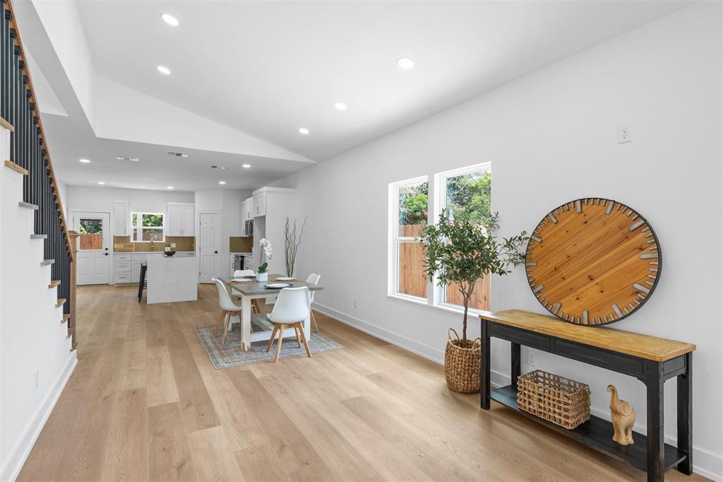721 Taylor Street Waco, TX 76704 - Photo 9 of 28 a living room with furniture a rug and a wall painting
