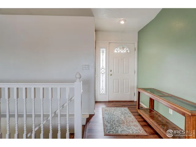 a view of hallway with wooden floor