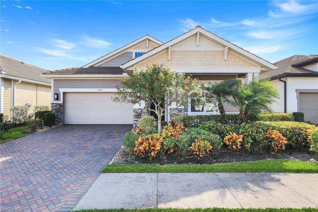 3529 Pilot Circle Naples, FL 34120 - Photo 11 of 47 a front view of a house with a yard