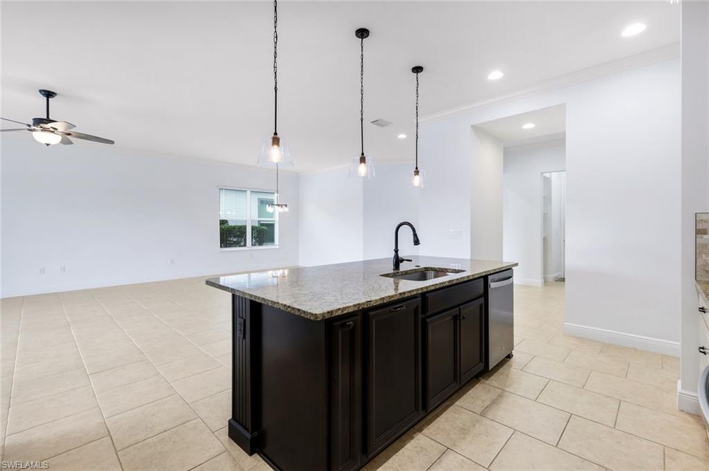 3529 Pilot Circle Naples, FL 34120 - Photo 18 of 47 a kitchen with a sink a counter space appliances and cabinets