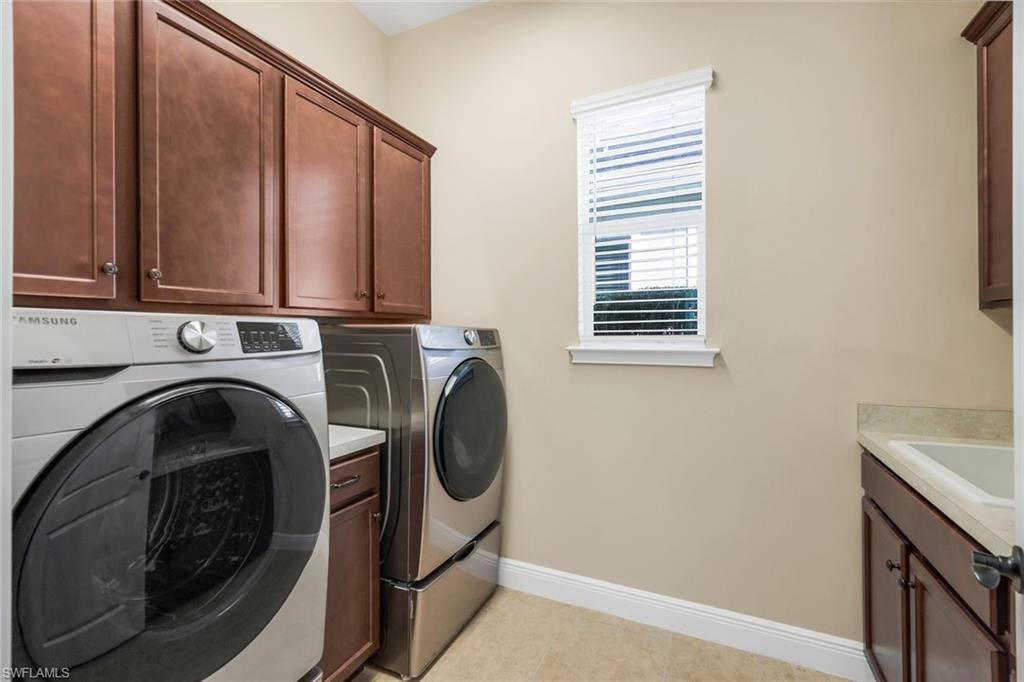 3529 Pilot Circle Naples, FL 34120 - Photo 29 of 47 a utility room with dryer and washer