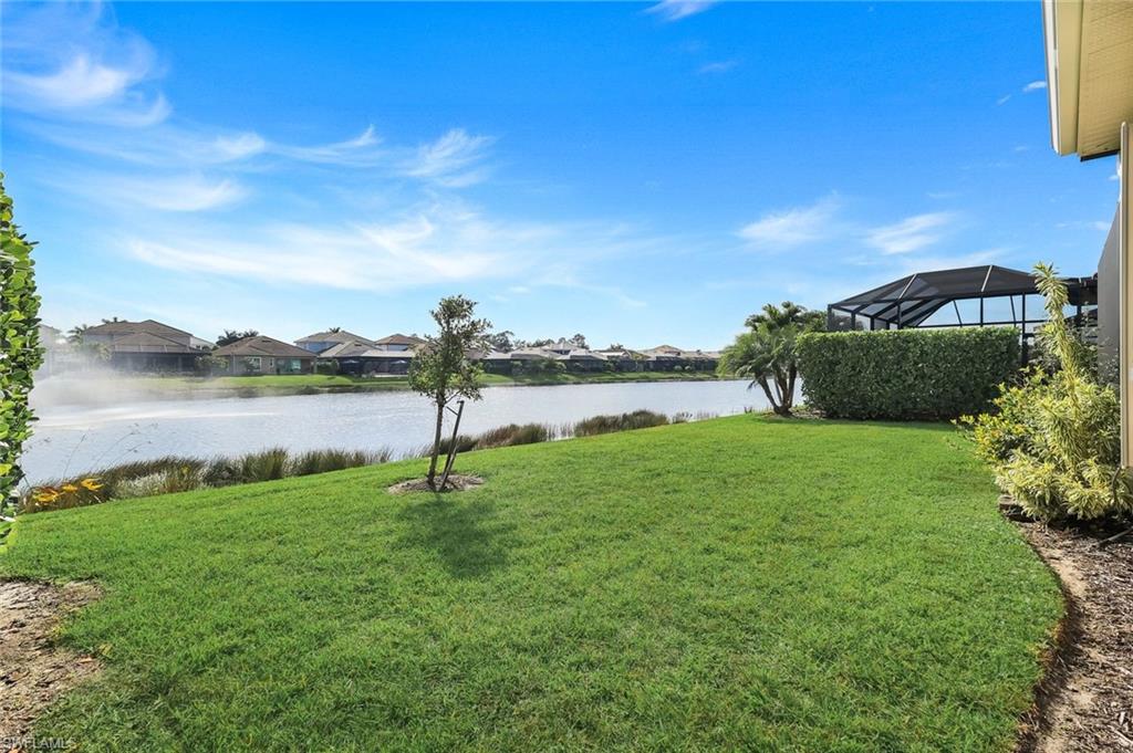 3529 Pilot Circle Naples, FL 34120 - Photo 32 of 47 a view of a lake with a big yard