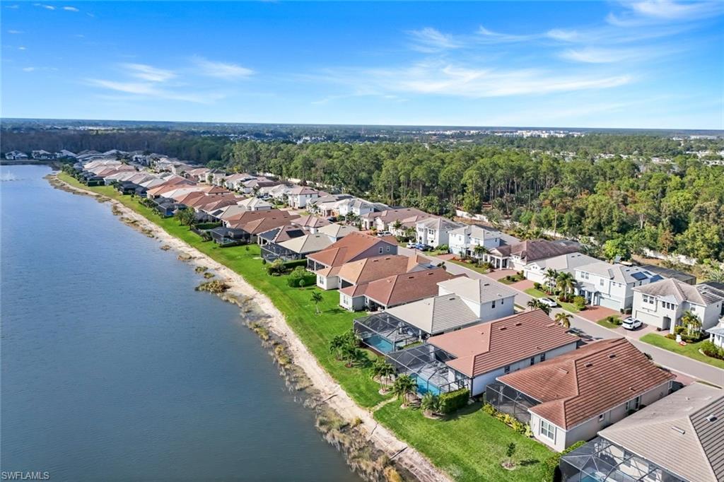3529 Pilot Circle Naples, FL 34120 - Photo 37 of 47 an aerial view of a city with lots of residential buildings ocean and mountain view in back