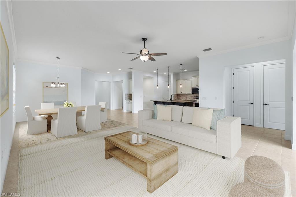 3529 Pilot Circle Naples, FL 34120 - Photo 4 of 47 a living room with furniture white walls and white walls