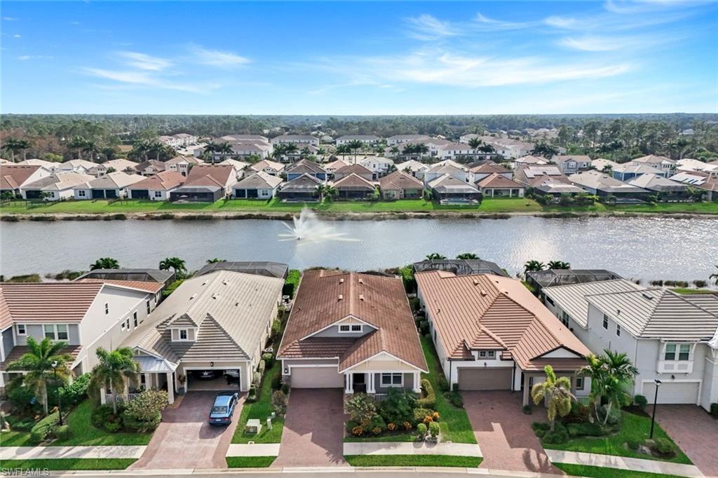 3529 Pilot Circle Naples, FL 34120 - Photo 44 of 47 an aerial view of a house with a lake view