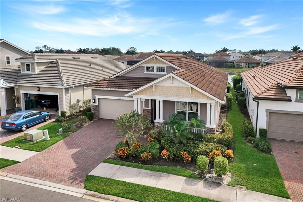 3529 Pilot Circle Naples, FL 34120 - Photo 46 of 47 front view of a house with a garden