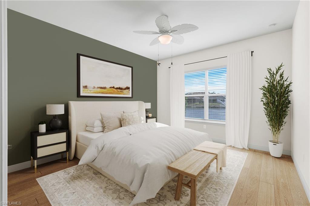 3529 Pilot Circle Naples, FL 34120 - Photo 5 of 47 a bedroom with a large bed chandelier and a window