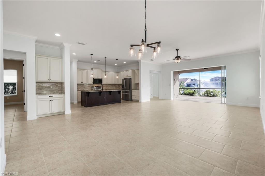 3529 Pilot Circle Naples, FL 34120 - Photo 7 of 47 a view of a kitchen with furniture and a kitchen