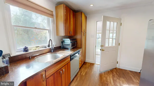 a kitchen with stainless steel appliances a sink and cabinets