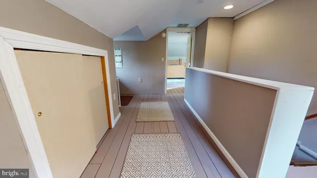 a view of gallery with wooden floor