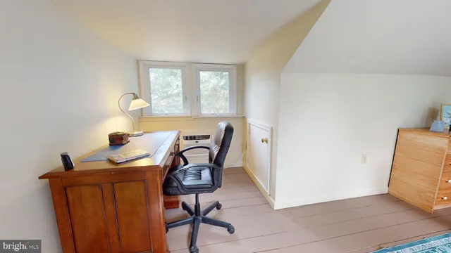 a workspace with furniture and wooden floor