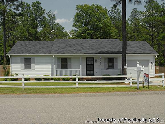 3360 Red Fox Road Spring Lake, NC 28390 - Photo 1 of 8 a front view of a house with a garden and plants
