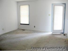 3360 Red Fox Road Spring Lake, NC 28390 - Photo 4 of 8 an empty room with a window