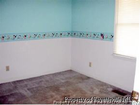 3360 Red Fox Road Spring Lake, NC 28390 - Photo 8 of 8 an empty room with wooden floor