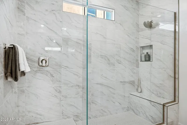 a bathroom with a shower and a sink