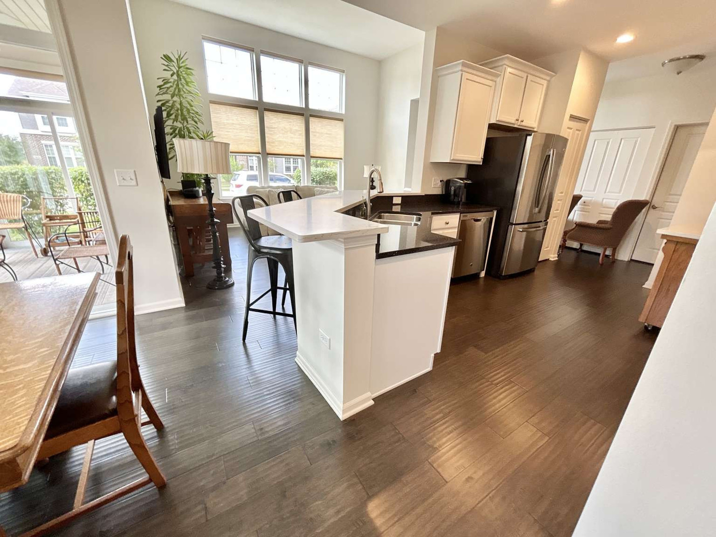 2603 Avondale Circle Naperville, IL 60564 - Photo 15 of 22 a view of kitchen and dining room with wooden floor
