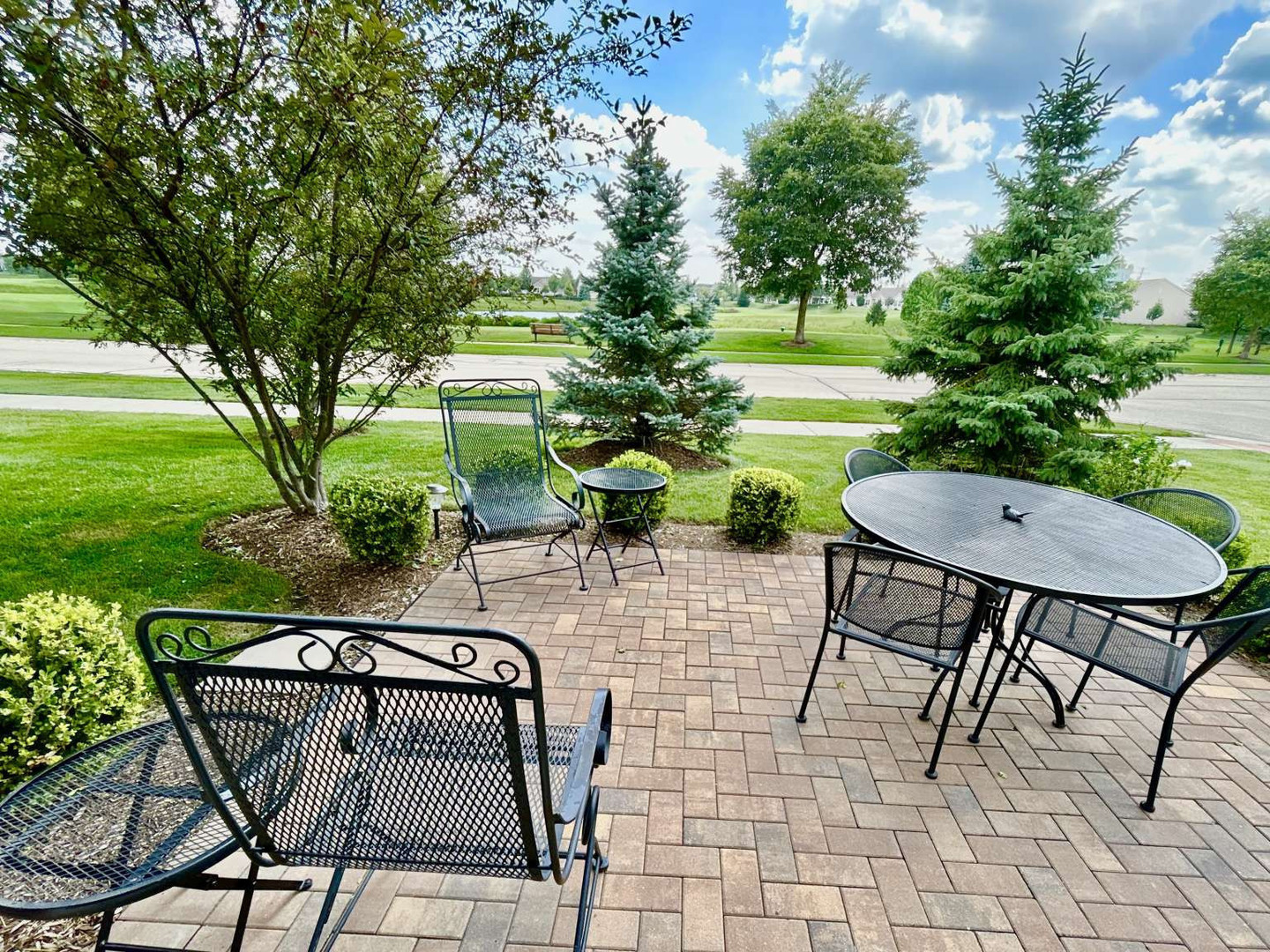 2603 Avondale Circle Naperville, IL 60564 - Photo 18 of 22 a view of a chairs and table in backyard