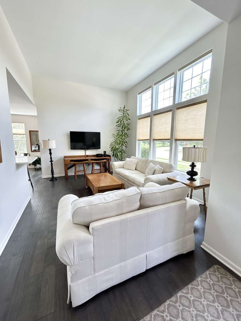 2603 Avondale Circle Naperville, IL 60564 - Photo 3 of 22 a living room with furniture and a flat screen tv