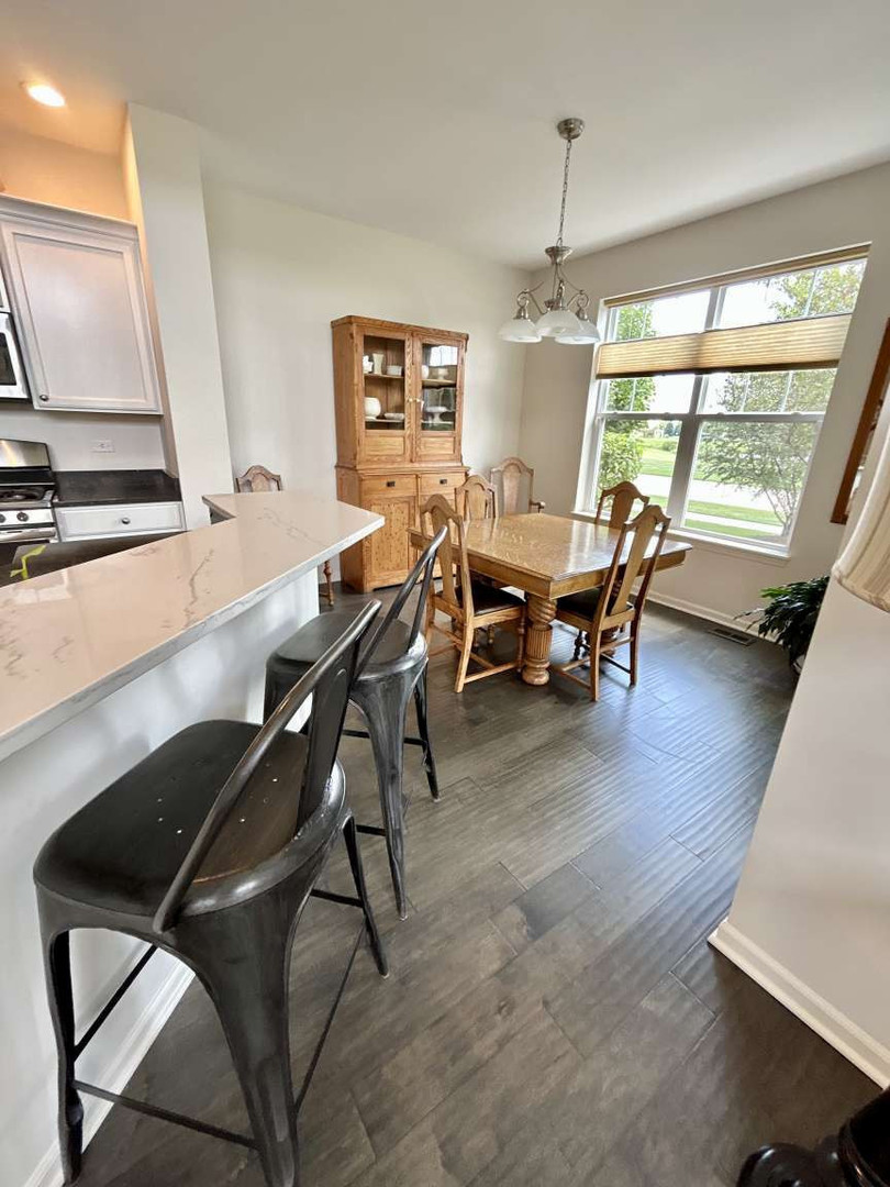 2603 Avondale Circle Naperville, IL 60564 - Photo 5 of 22 a dining room with furniture and window
