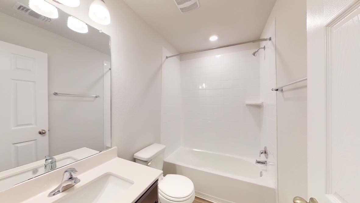 300 Creekfall Road Burnet, TX 78611 - Photo 18 of 23 a bathroom with a sink toilet and shower