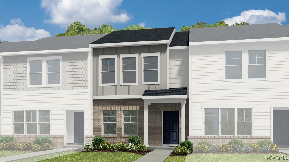 240 Greenpark Road Sandston, VA 23150 - Photo 1 of 3 a front view of a house with a yard