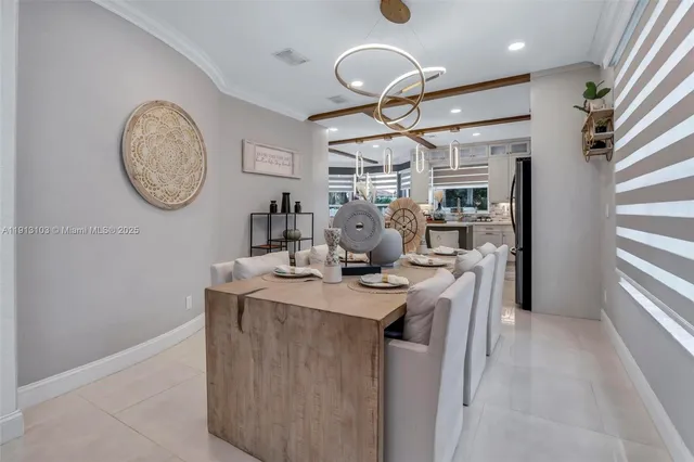 a kitchen with stainless steel appliances granite countertop a sink a stove and cabinets