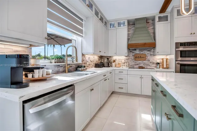 a bedroom with furniture and a large window