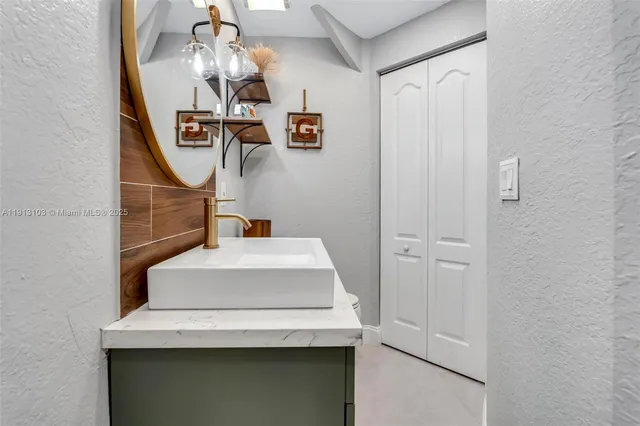 a bedroom with a bed and flat screen tv