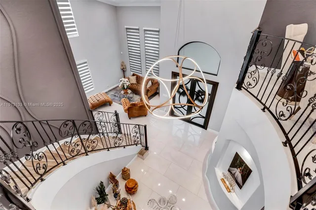 a view of a house with swimming pool and sitting area