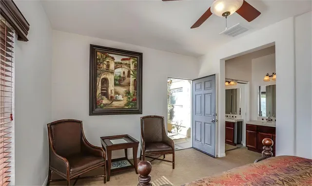 a view of a livingroom with workspace and a couch