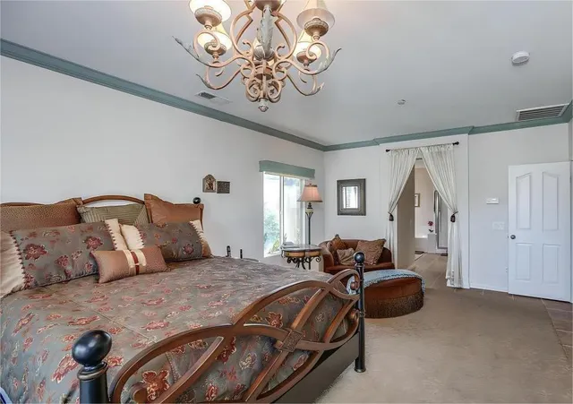 a bedroom with bed and window