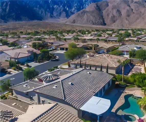 an aerial view of a houses with a outdoor space