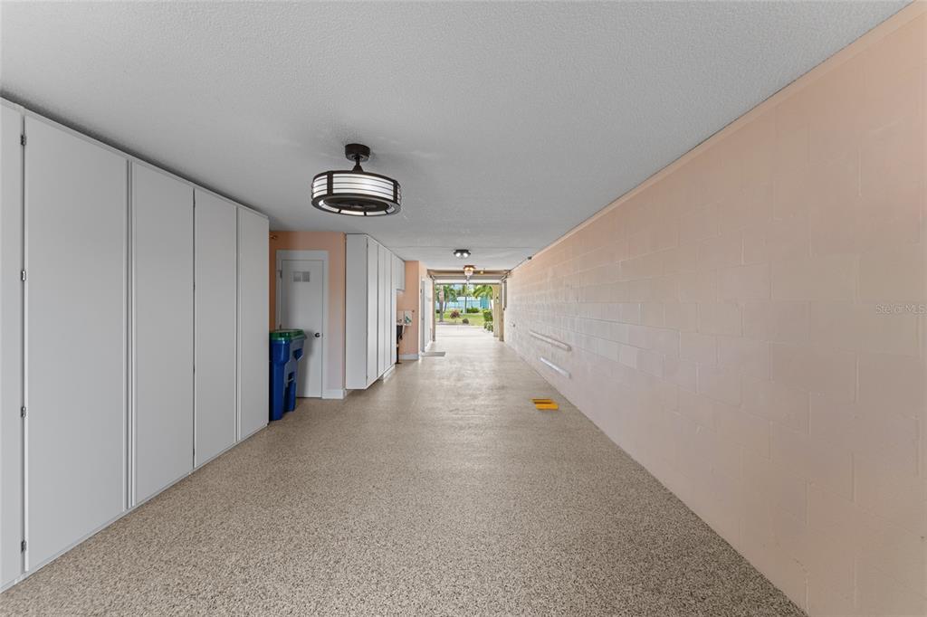 128 Marcdale Boulevard Indian Rocks Beach, FL 33785 - Photo 11 of 74 a view of a hallway with a ceiling fan