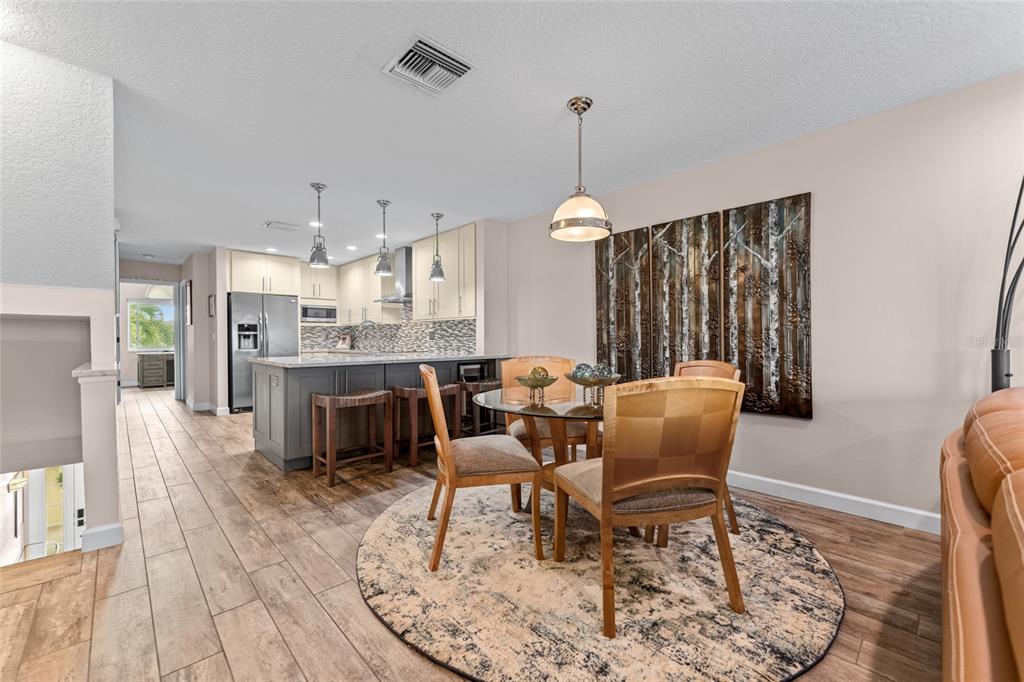128 Marcdale Boulevard Indian Rocks Beach, FL 33785 - Photo 17 of 74 a living room with furniture and a wooden floor