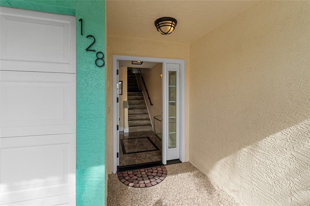 128 Marcdale Boulevard Indian Rocks Beach, FL 33785 - Photo 3 of 74 a view of entryway with wooden floor