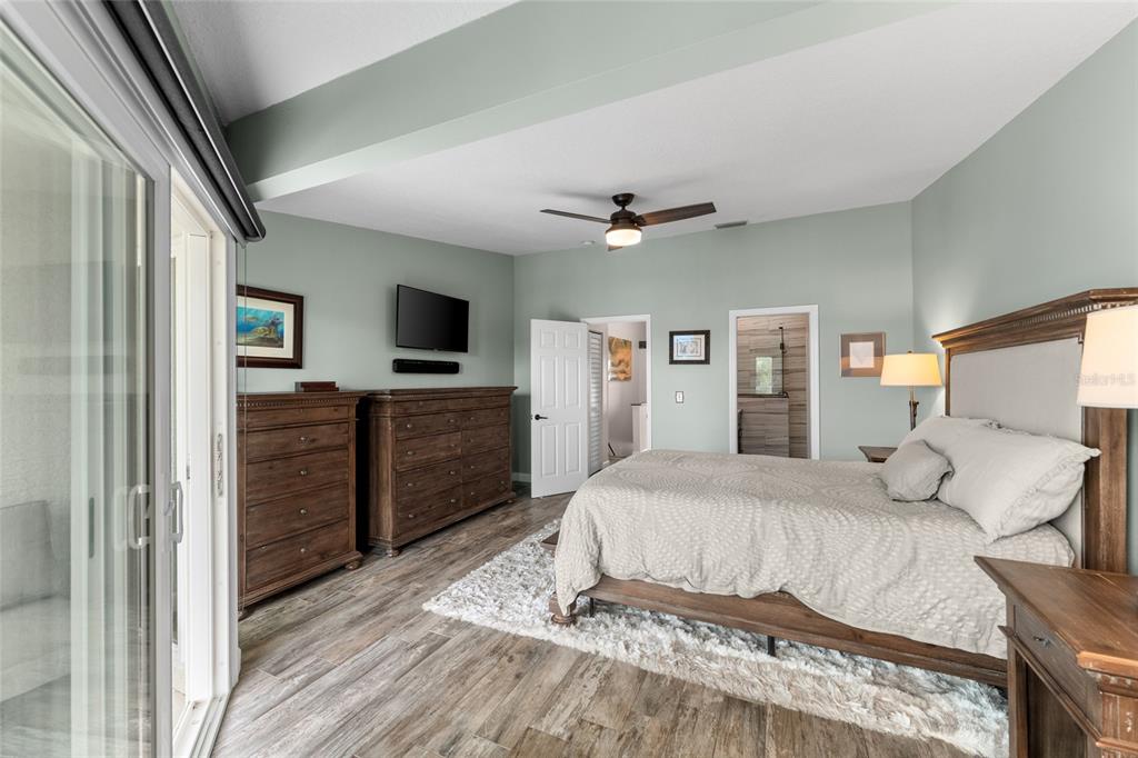 128 Marcdale Boulevard Indian Rocks Beach, FL 33785 - Photo 38 of 74 a bedroom with a bed and a flat screen tv