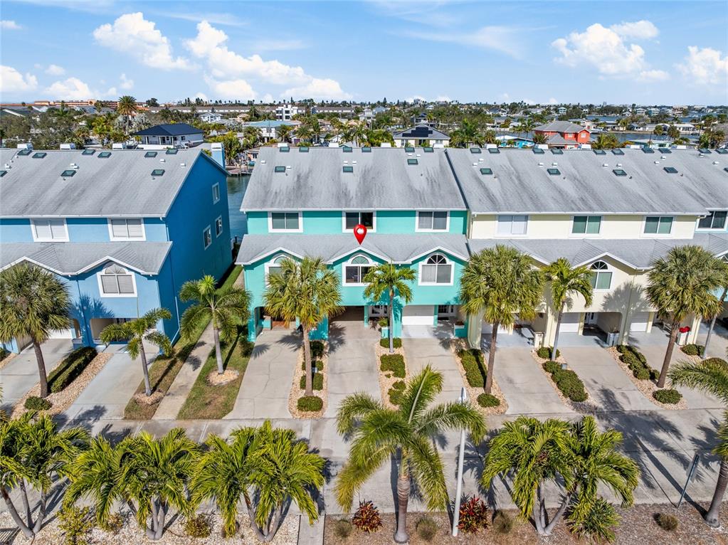 128 Marcdale Boulevard Indian Rocks Beach, FL 33785 - Photo 56 of 74 an aerial view of residential houses with outdoor space and swimming pool