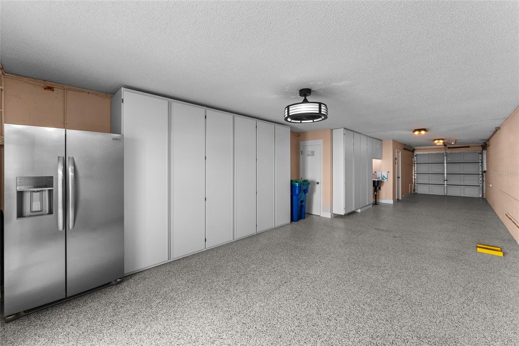 128 Marcdale Boulevard Indian Rocks Beach, FL 33785 - Photo 9 of 74 a view of a refrigerator and storage in a room