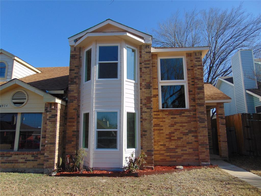 4912 Berridge Lane Dallas, TX 75227 - Photo 1 of 18 a front view of a house
