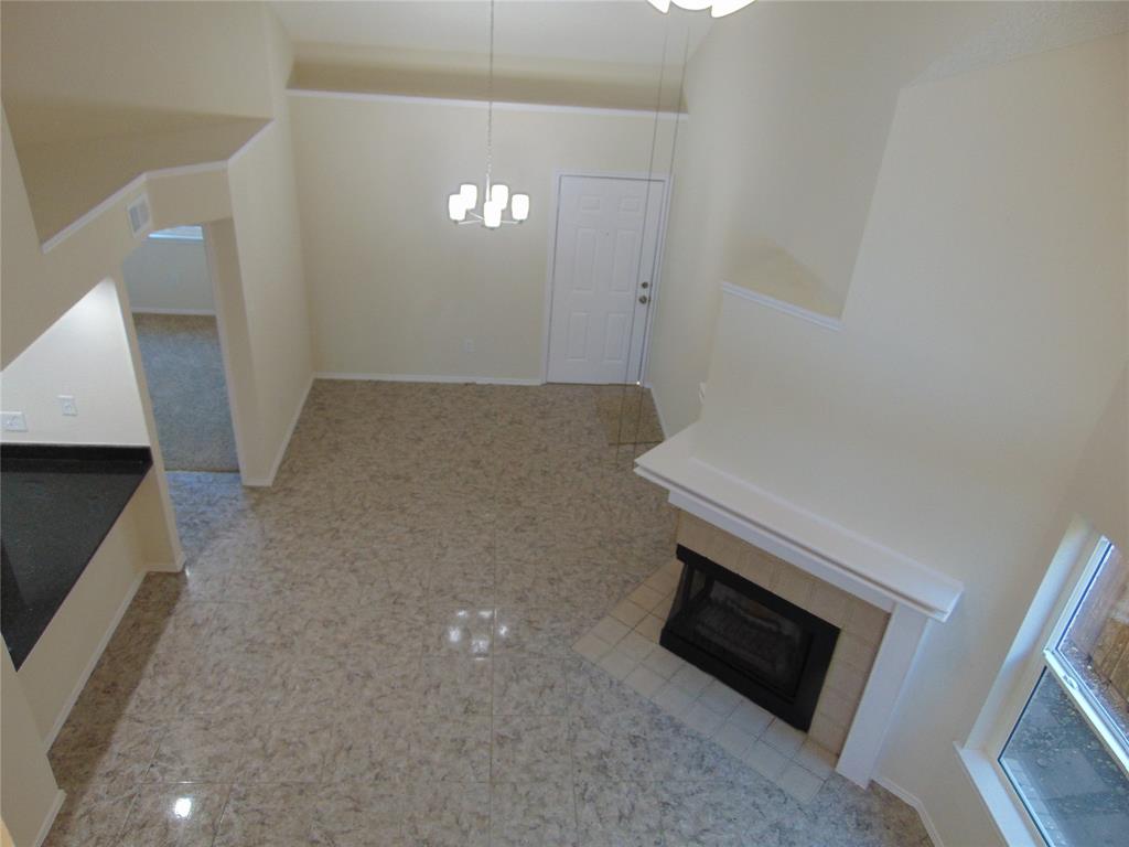 4912 Berridge Lane Dallas, TX 75227 - Photo 14 of 18 a view of a livingroom with furniture and a fireplace