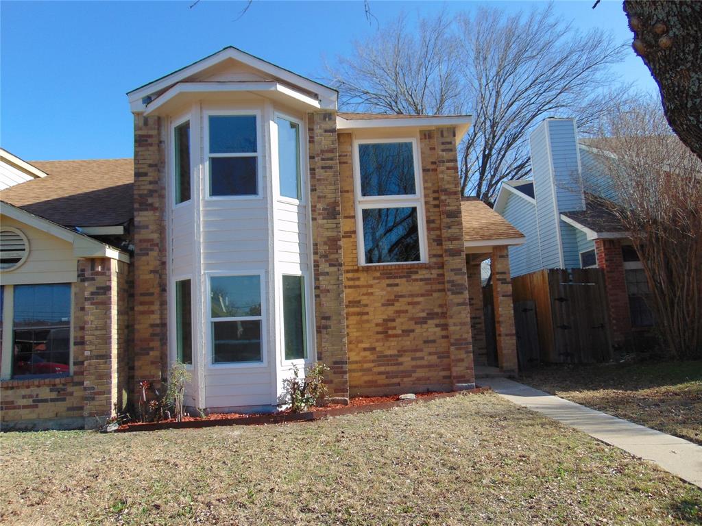 4912 Berridge Lane Dallas, TX 75227 - Photo 18 of 18 a front view of a house with a yard