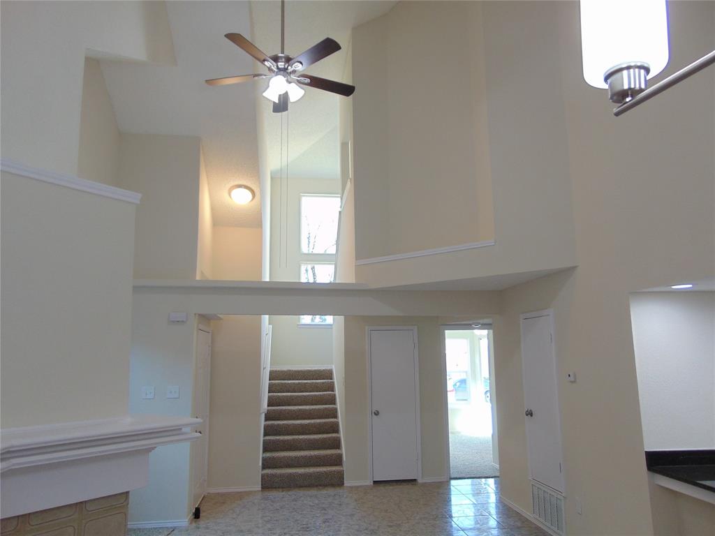 4912 Berridge Lane Dallas, TX 75227 - Photo 6 of 18 a view of an entryway with a chandelier fan