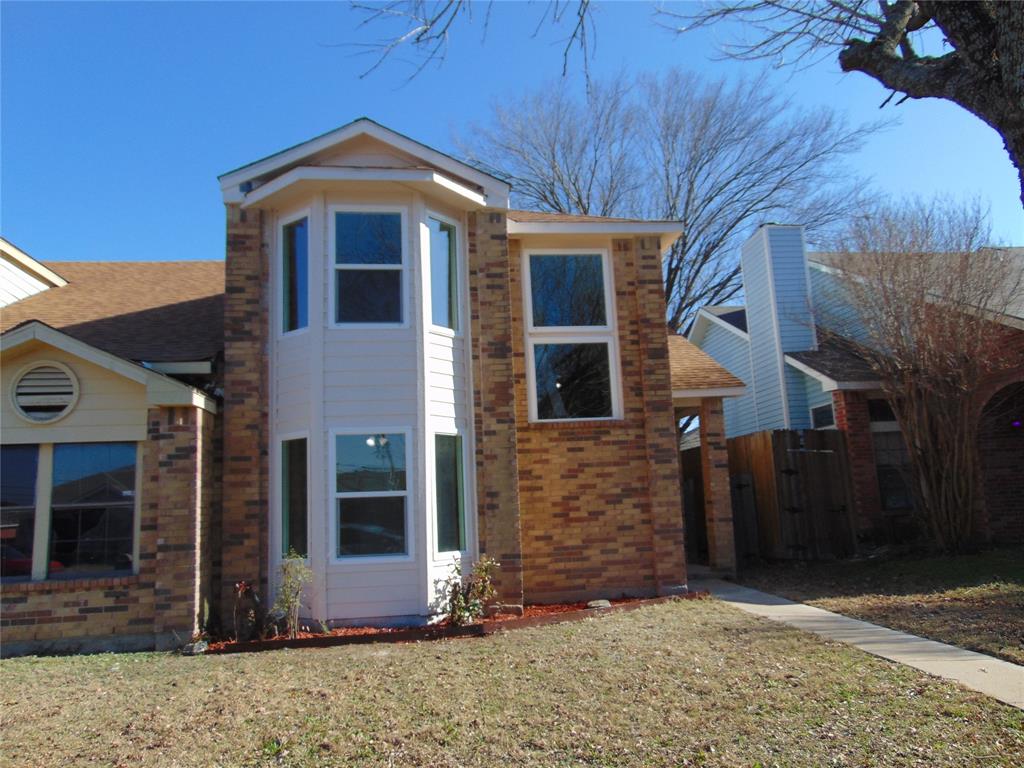 4912 Berridge Lane Dallas, TX 75227 - Photo 7 of 18 a front view of a house with a yard