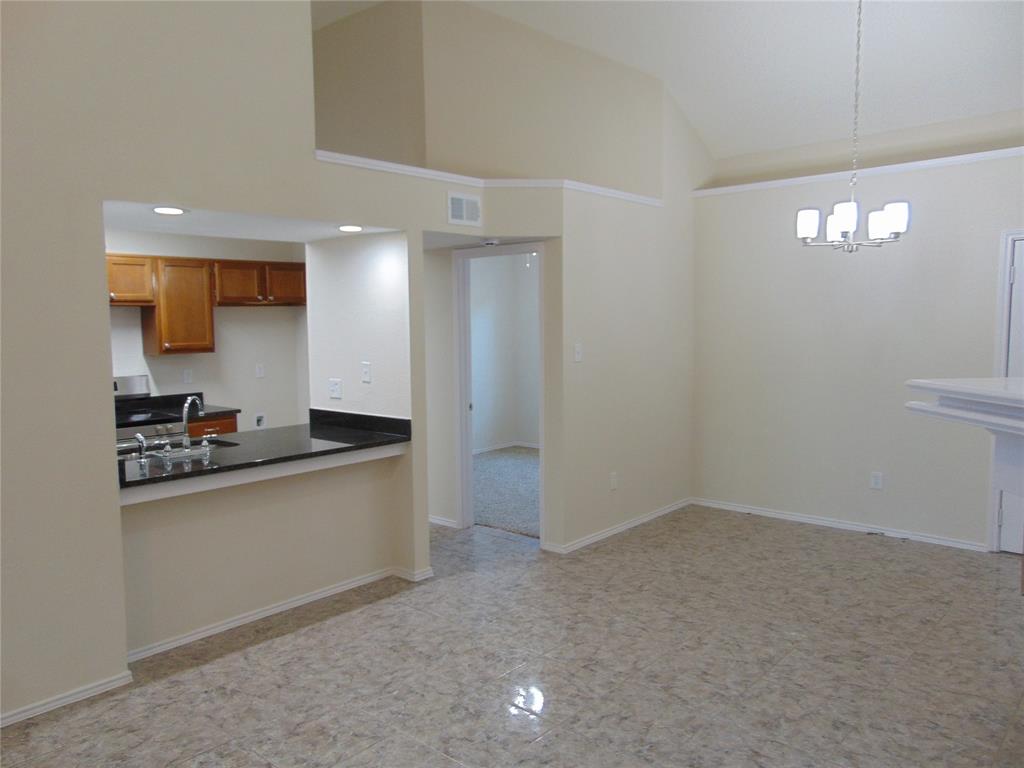 4912 Berridge Lane Dallas, TX 75227 - Photo 9 of 18 a kitchen with a sink cabinets and appliances