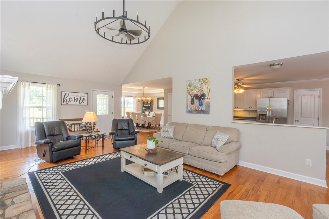 861 North Old Pendleton Road Liberty, SC 29657 - Photo 6 of 45 An inviting gathering space features soaring vaulted ceilings and rich hardwood flooring throughout.
