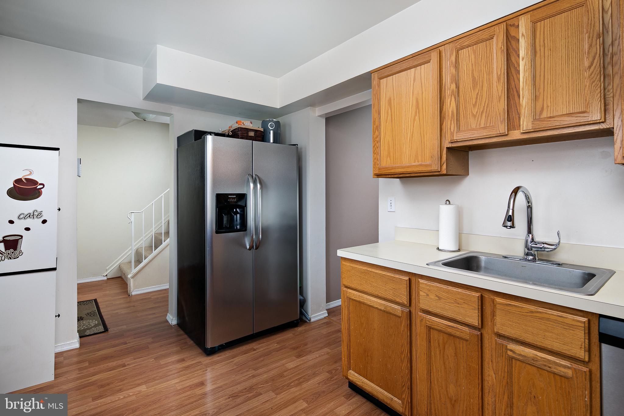 7529 Remington Road Manassas, VA 20109 - Photo 7 of 25 Kitchen with warm hardwood and newer appliances