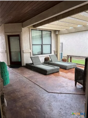 a house view with outdoor seating space