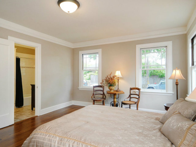 100 Stanley Road Burlingame, CA 94010 - Photo 9 of 14 a bedroom with a bed and wooden floor
