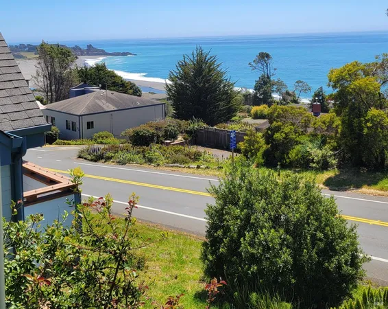 an aerial view of a house with a garden