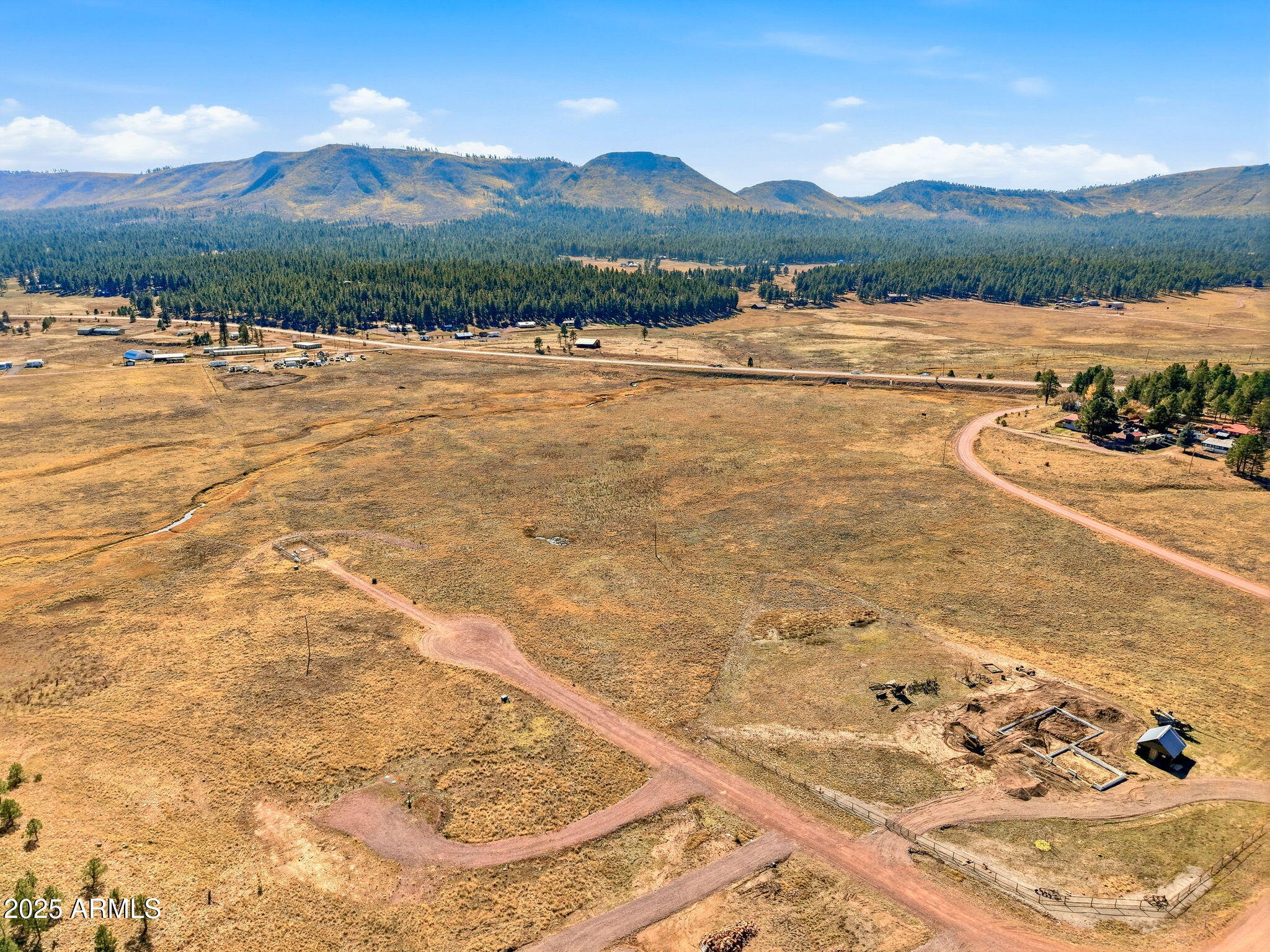 Lot 25 The Ranch, Unit 25 Alpine, AZ 85920 - Photo 2 of 21 a view of a lake and mountain